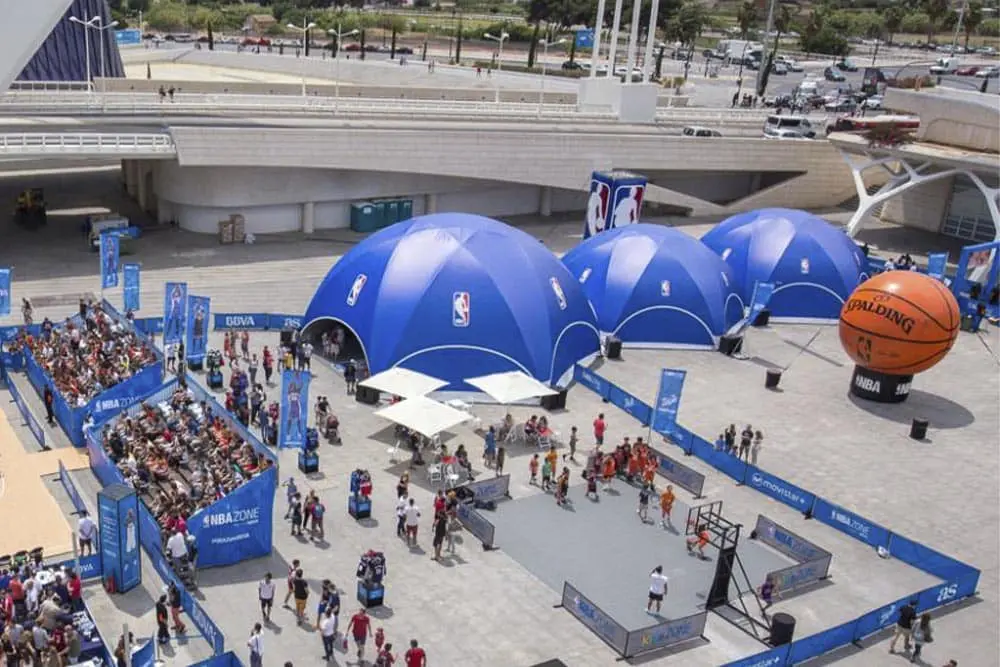 EJH Distribution NBA event setup with branded tents and gaming areas in an outdoor venue.