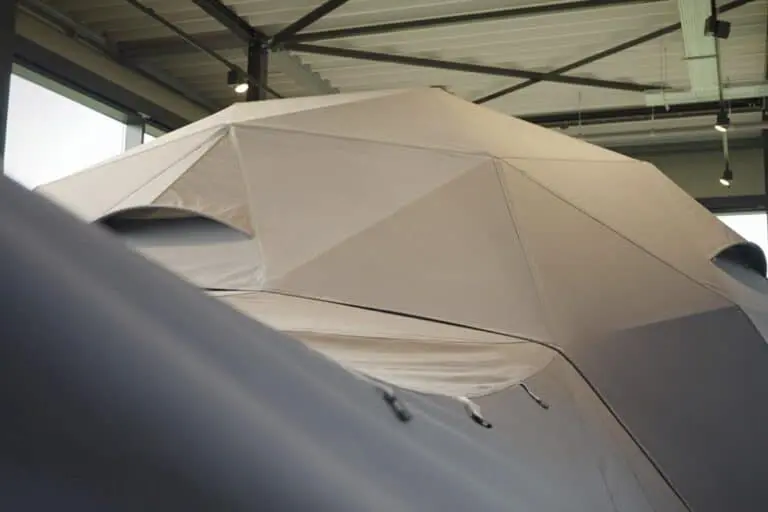 EJH Distribution warehouse with large industrial umbrella for event or outdoor protection.