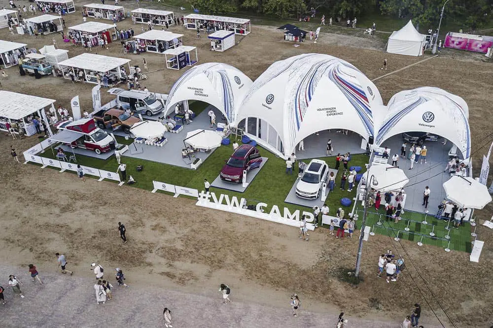 Sustainable automotive event showcasing Volkswagen cars at EJH Distribution exhibit.