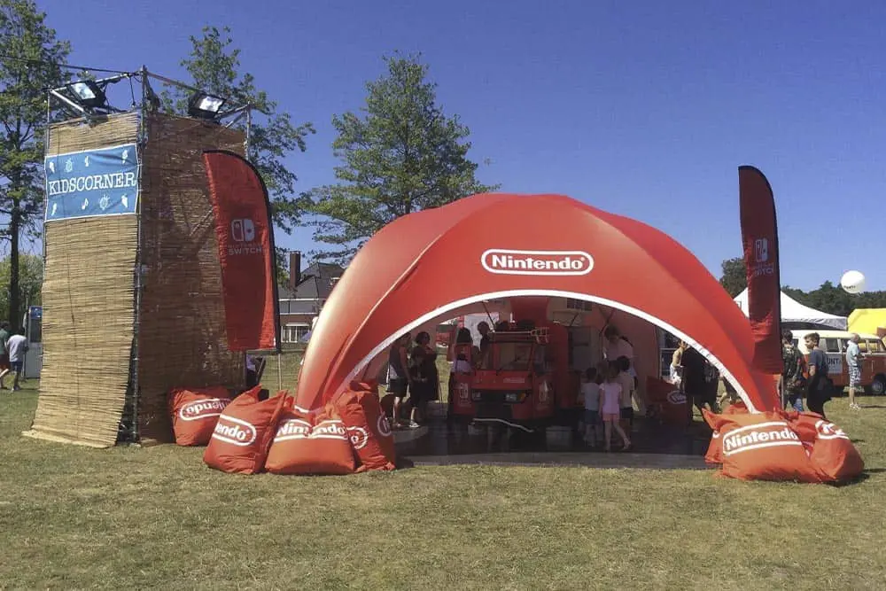 Nintendo branded event tent and display at an outdoor festival.