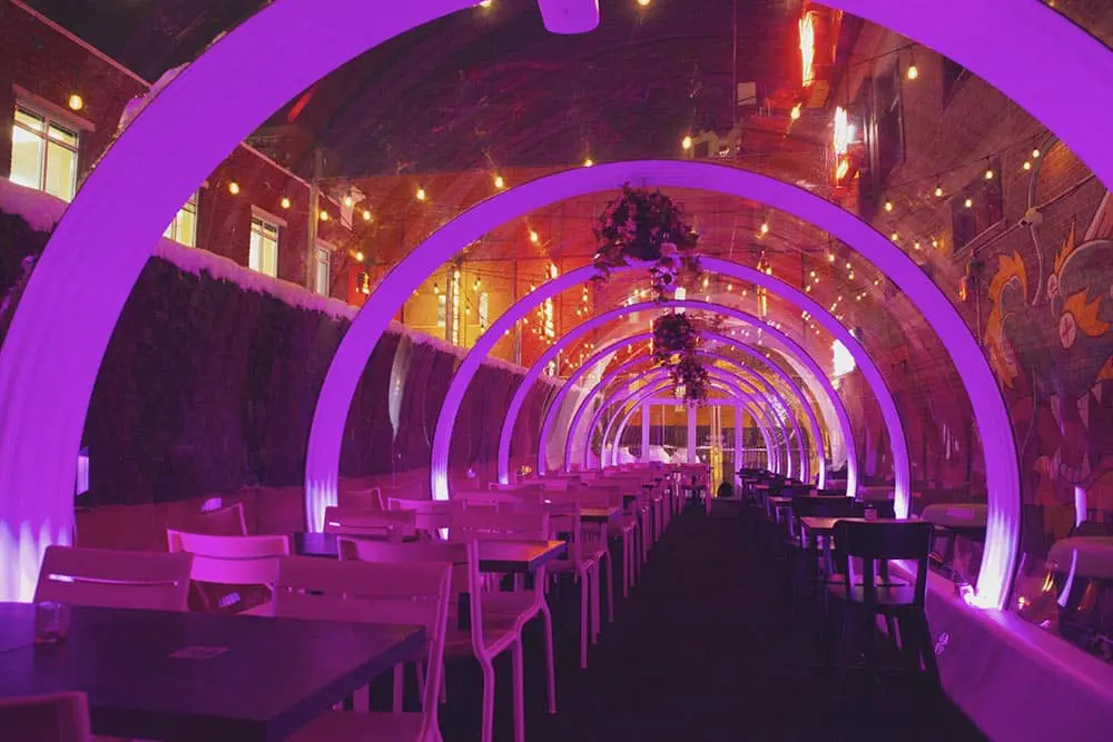 Colorful illuminated tunnel at EJH Distribution event space, perfect for parties and celebrations.