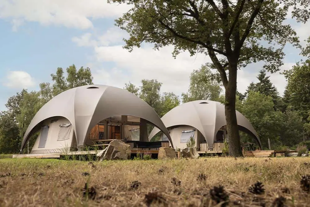 Eco-friendly geodesic domes for sustainable glamping accommodations.