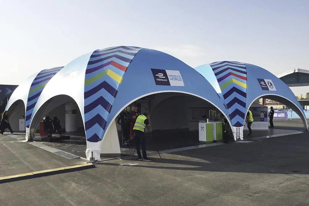 Colorful event tent with "Formula E" branding for motorsport races and trade shows.
