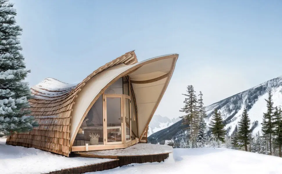 Unique A-frame wooden mountain cabin with snow-covered landscape in the background, eco-friendly GLAMPING lodging.