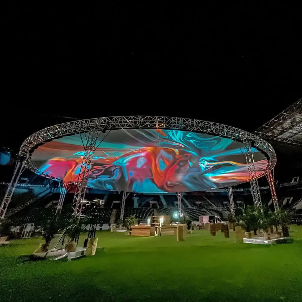 Colorful LED screen display at night showcasing digital event visuals.