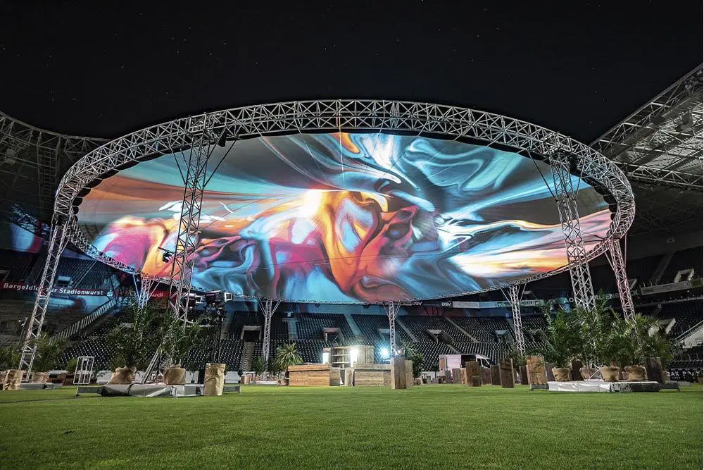 Vivid large outdoor LED screen display at a stadium or event venue.