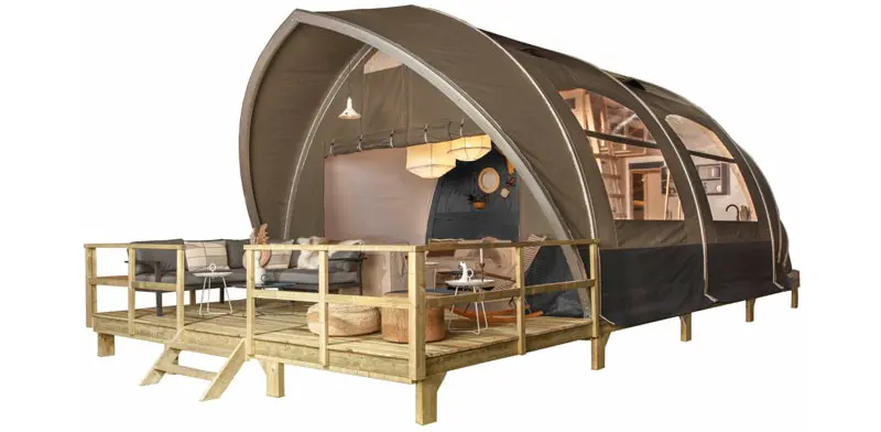 Modern outdoor glamping tent with wooden deck and cozy interior for luxurious camping experiences.