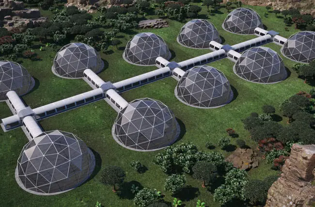 Futuristic eco-friendly dome buildings connected by skywalks in green landscape.