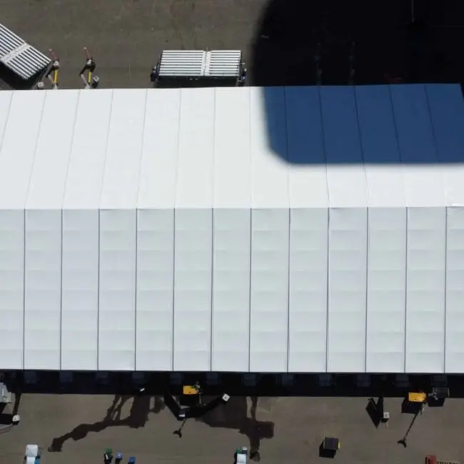 White event tent structure for outdoor gatherings and exhibitions.