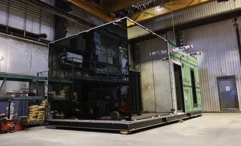Heavy industrial 3D printing machine in a warehouse setting at EJH Distribution.