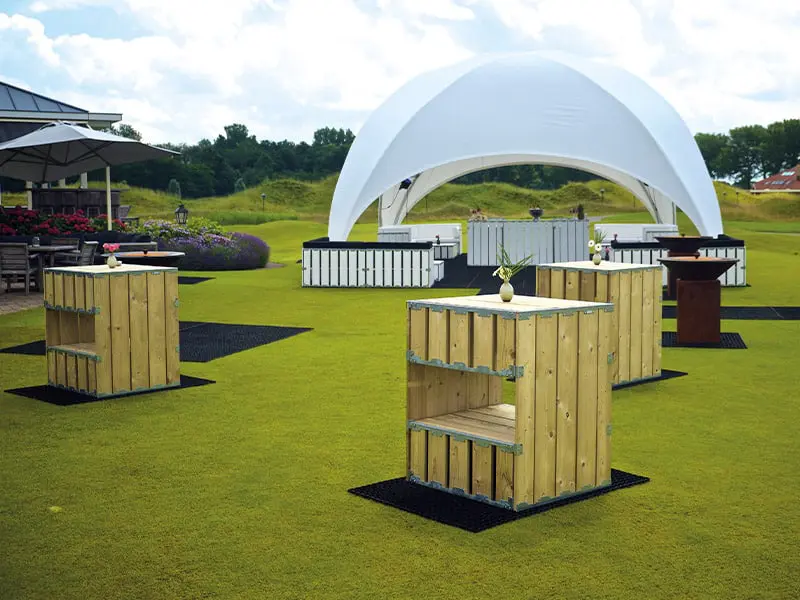 Portable outdoor event bar stations on a golf course.