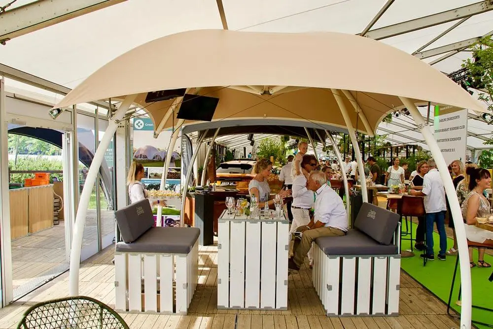 Elegant outdoor dining area with stylish parasols at EJH Distribution. Perfect for events and hospitality solutions.