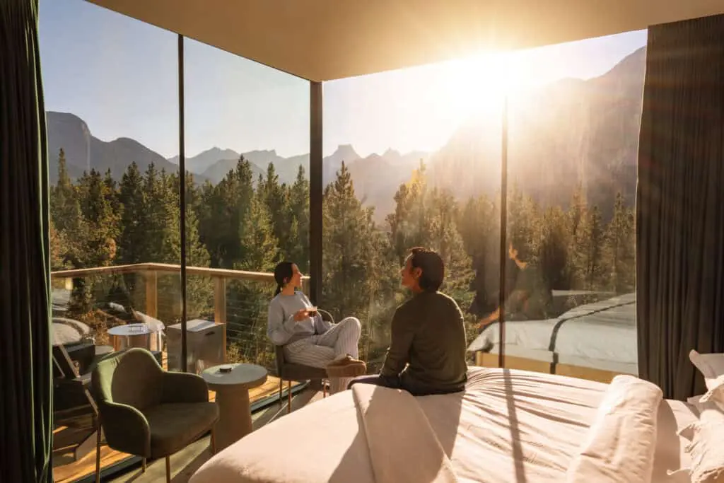 Bright tiny home with large glass windows overlooking mountains and forest. Perfect for minimalist living and outdoor enthusiasts seeking a peaceful retreat.
