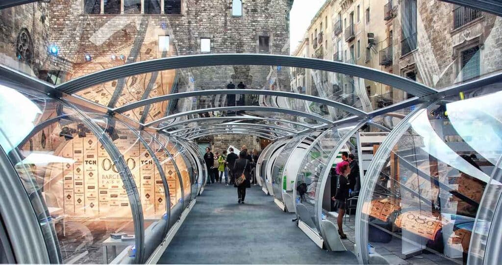 Glass tunnel at Barcelona Maritime Museum, showcasing innovative trade and maritime industry displays.