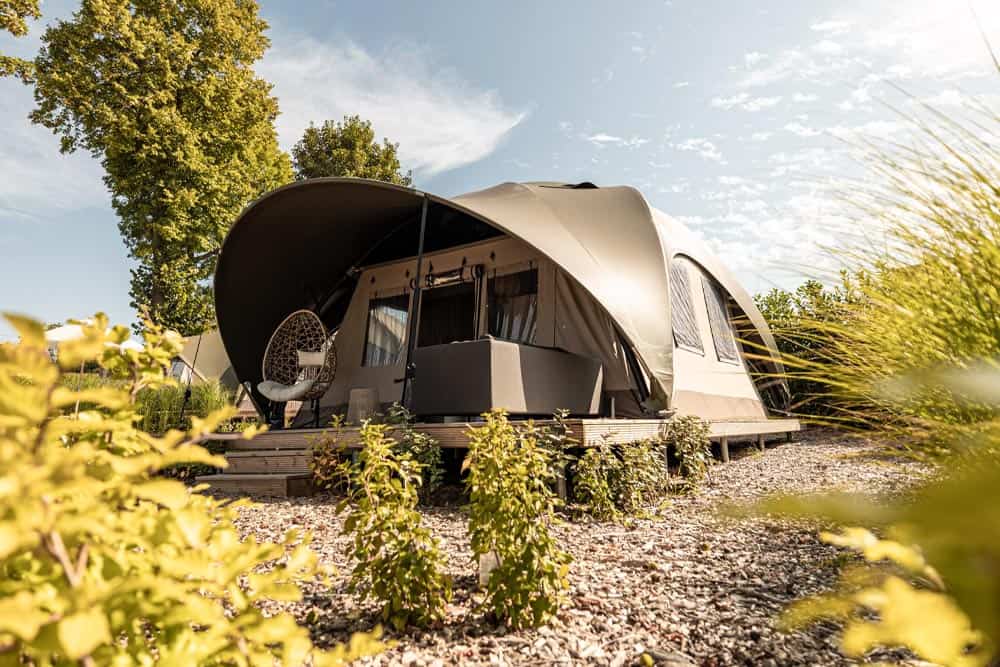 Luxury glamping tent outdoor camping scenic landscape.