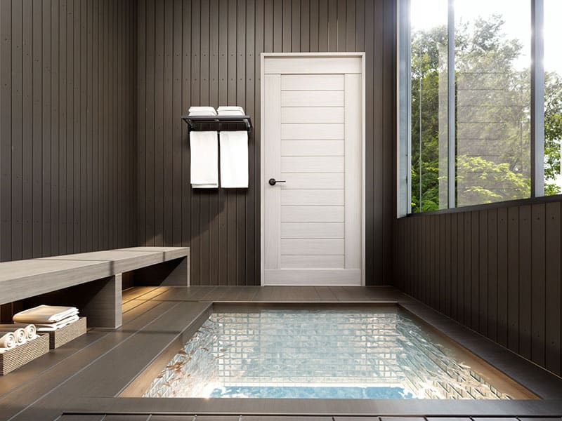 Modern steam room with wooden walls and large window, indoor spa facility, relaxation area, wellness center, luxurious bathroom design, EJH Distribution.